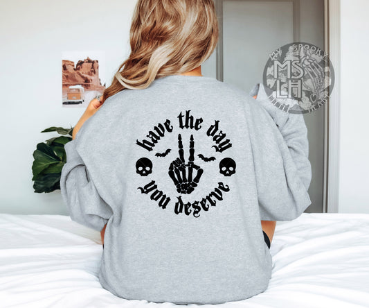Have the day you deserve (Black Text) Pocket and Back Design.