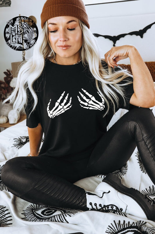 Skeleton hands holding boobies